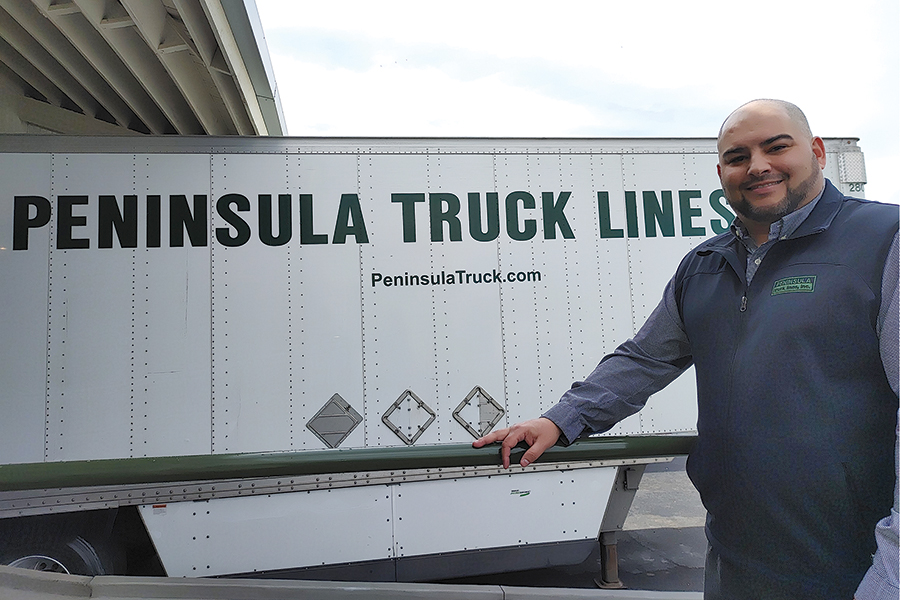 Craig Testerman, manager of the Peninsula Truck Lines Kennewick terminal, 900 E. Bruneau St., stands outside a loading dock. (Photo by Wendy Culverwell)