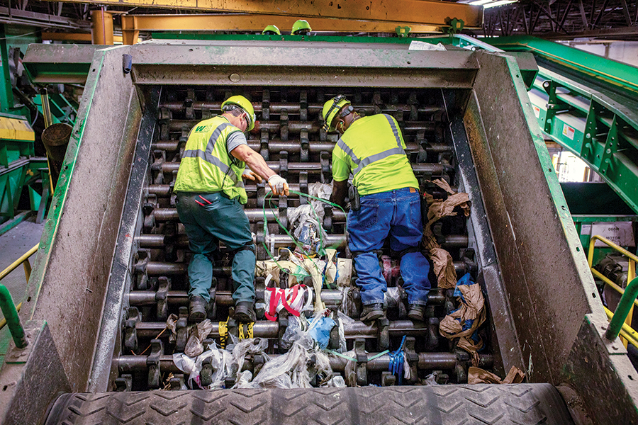 Plastic bags get tangled in the sorting equipment and can shut down an entire facility, posing safety hazards to workers who have to remove them from the machinery. (Courtesy Waste Management)