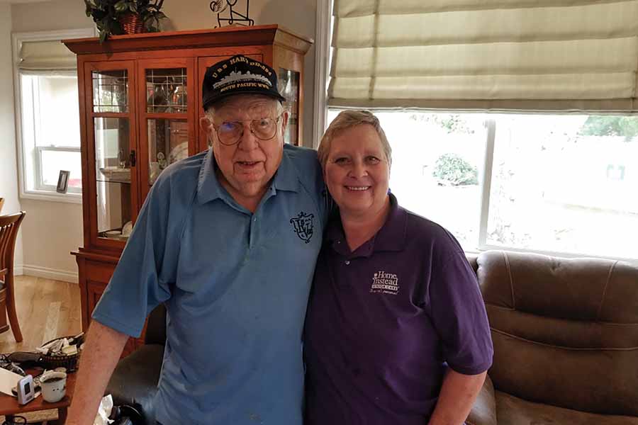 Lisa Seger, right, a Kennewick Home Instead lead care professional, stands
with her client, Bill, a World War II veteran. Home Instead has developed
Elderoscopy, an educational program with tools to help start the conversation
between aging parents and loved ones about preparing for their later years. (Courtesy Home Instead)