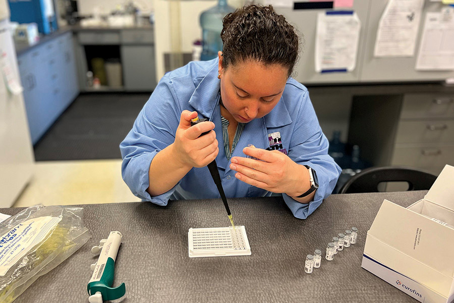 Jillian Legard, a lab supervisor for the Benton-Franklin Health District, tests
water samples for algae blooms. (Courtesy Benton-Franklin Health District)