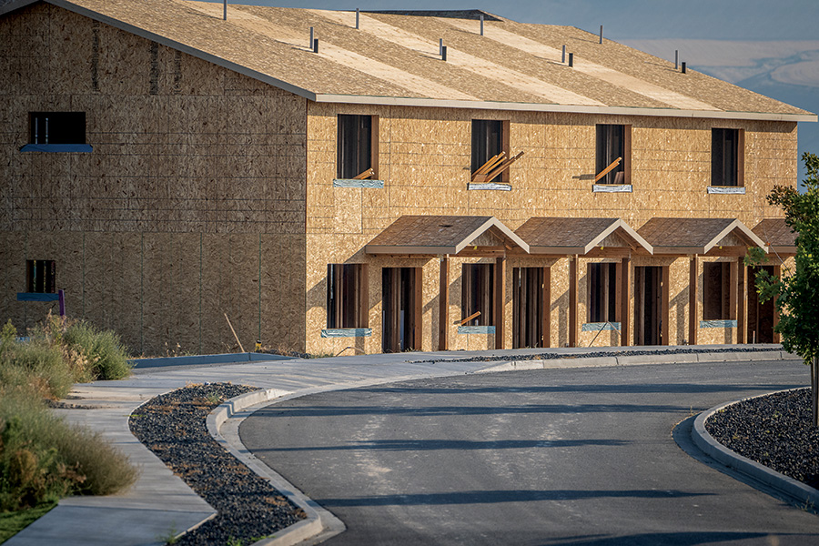 Tri-City residential construction may be slowing but demand remains constant, propelled by job and population growth. This multifamily development is on the south slope of Badger Mountain, off Dallas Road. (Photo by Scott Butner Photography)