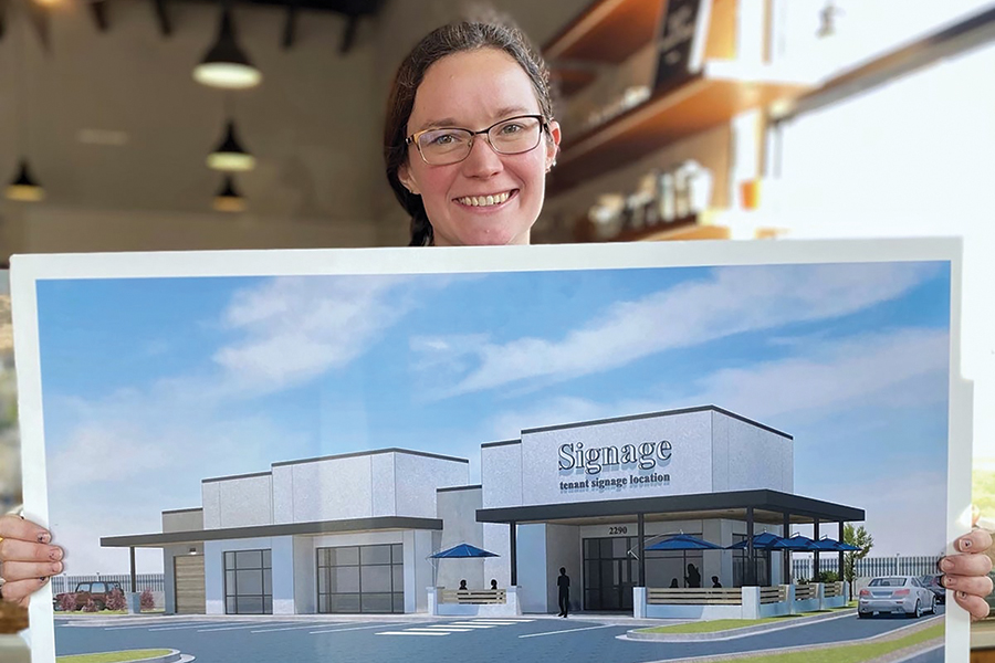 Dorcas Buckley, front of the house manager for Ethos Bakery and Café, displays the proposed building planned for its new location at 2290 Keene Road in Richland. Customers can visit the store at 702 The Parkway in Richland. (Courtesy Ethos Bakery)