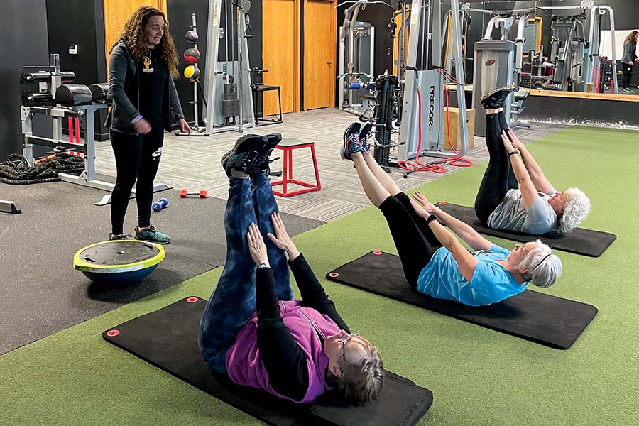 Claude Hafez provides personal training to clients of all ages, but has a passion for working with seniors, including, from left, Joan Young, Maggie Shearer and Loria Kirsch. (Photo by Robin Wojtanik)