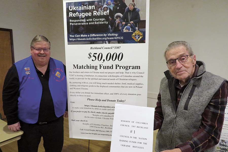 Grand Knight Bill Murray, left, and Bob Zinsli, a past Grand Knight, seek to reach their goal of raising $100,000 in a yearlong effort to help Ukrainian refugees. They are members of the Richland Knights of Columbus Council 3307, which has raised the most in the national campaign. (Photo by Kristina Lord)