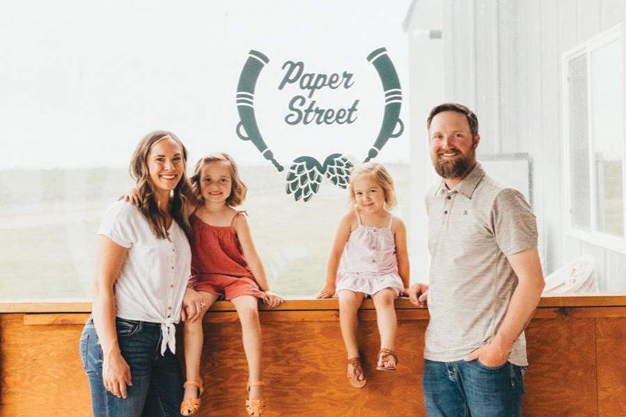 Kelsey and John Plughoff, owners of Paper Street Brewing Company in Pasco, stand with their daughters, June and Jade. A recent closure allowed them to redecorate and spruce up their brew pub, which features a farm atmosphere that welcomes families.  (Courtesy Paper Street Brewing Company)