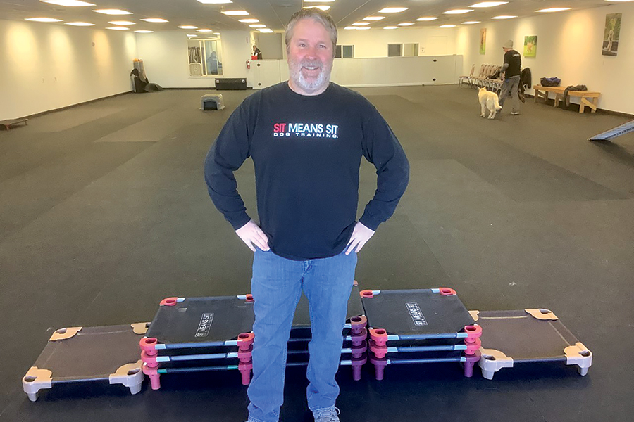 Steve Sprague recently expanded his Sit Means Sit dog training facility in downtown Kennewick. He said the pandemic increased demand for dog trainers. (Photo by Jeff Morrow)