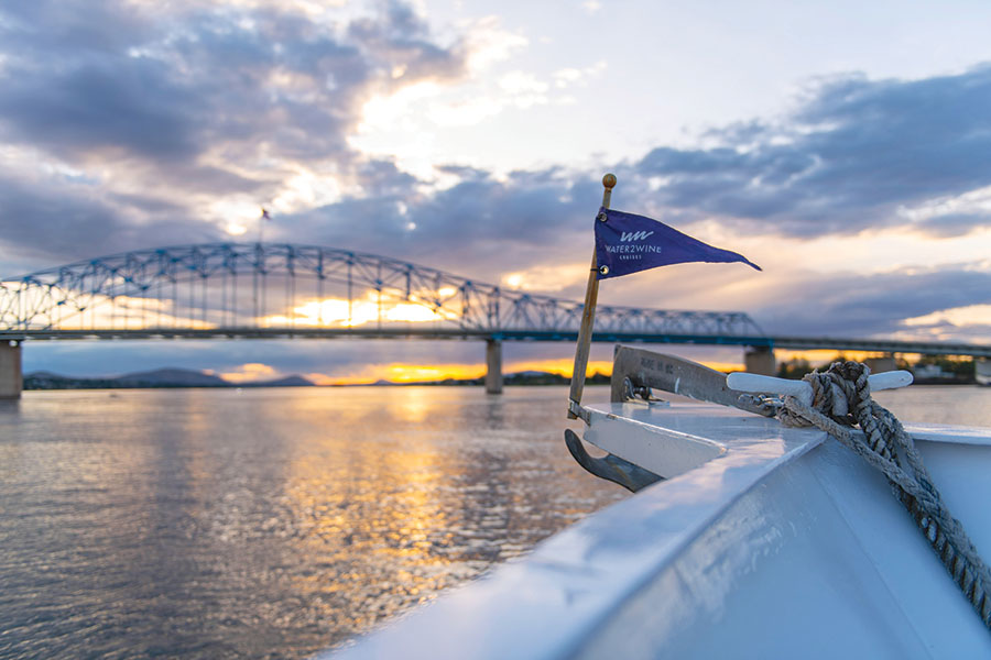 The blue bridge looms over the bow of the West Star, one of Water2Wine’s vessels, on a recent Columbia River dinner cruise. (Photo by Ryan Jackman)