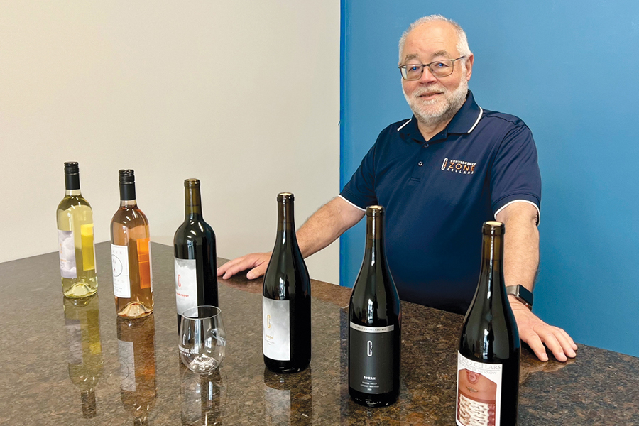 Scott Greenberg stands in the tasting room at Convergence Zone Cellars in Richland. He moved the North Bend-based winery to the Tri-Cities, with an opening planned on June 16. The winery is in the new Flex Space Business Centers at 1339 Tapteal Drive, Suite 104. (Photo by Sara Schilling)