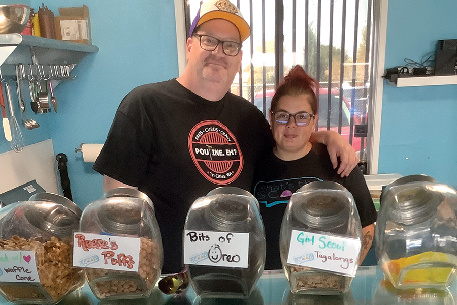 Robert and Mallory Chapin love to sell customers exciting flavors of ice cream in their What’s the Scoop? store in Kennewick. The shop is next door to their other venture, Poutine, Eh?, which serves up French-Canadian poutine dishes. The restaurants are at 3902 W. Clearwater Ave., suites 119 and 120, in Kennewick. (Photo by Jeff Morrow)
