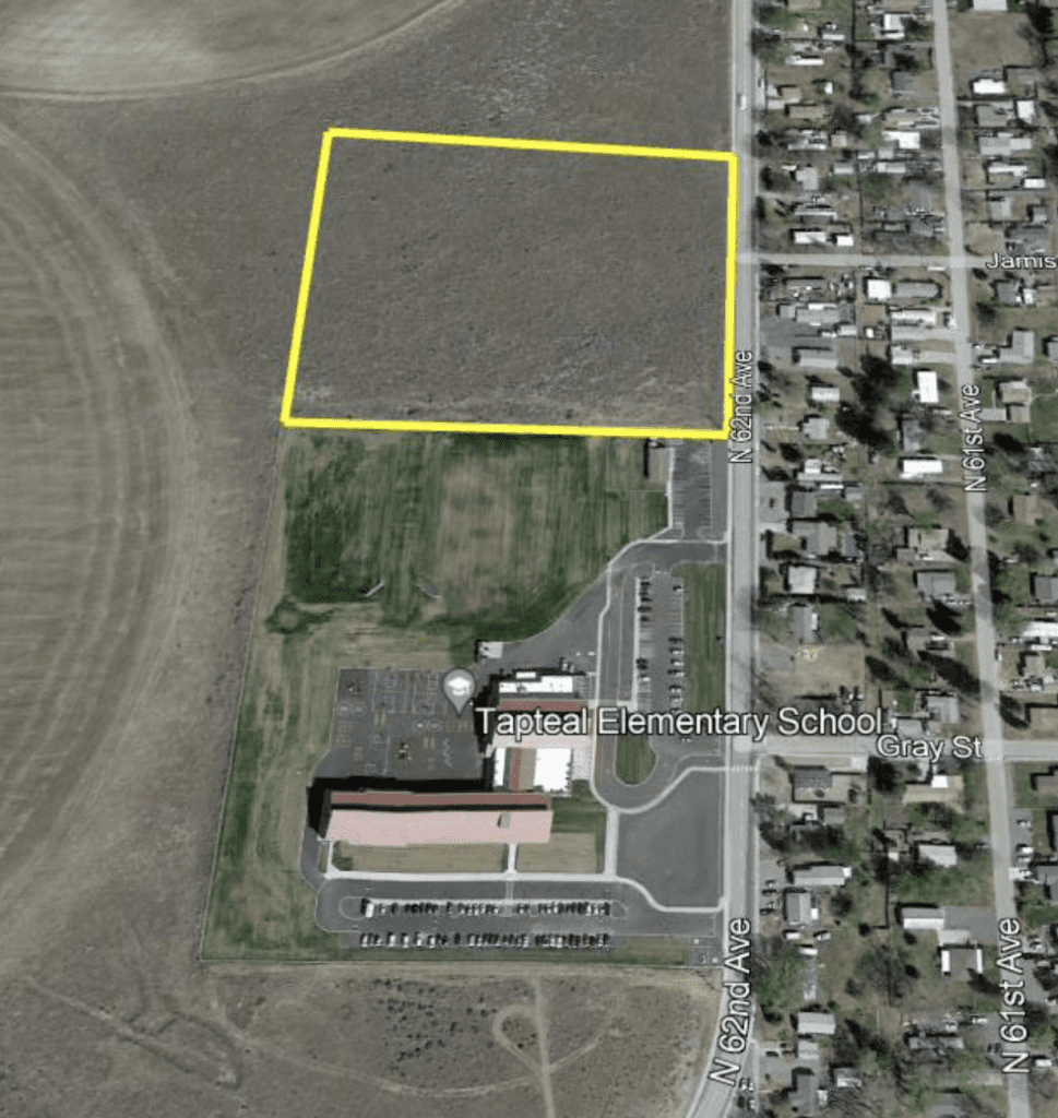 Satellite map of the area around Tapteal Elementary School in West Richland, with a yellow box around the 10-acre parcel that's being transferred to the Richland School District.